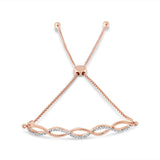 14K Rose Gold Plated .925 Sterling Silver 1/10 cttw Diamond Infinity Twist 4â€-10â€ Adjustable Bolo Bracelet (I-J Color, I2-I3 Clarity)